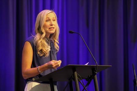 Courtney Moore, founder and president of Women and Work, speaks in chapel. - Photo by Abigail Aspinwall