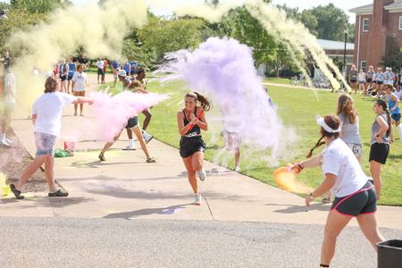 Students run through the color portion of the Residence Life 1/2K. - Photo by Kristi McMurry Woody