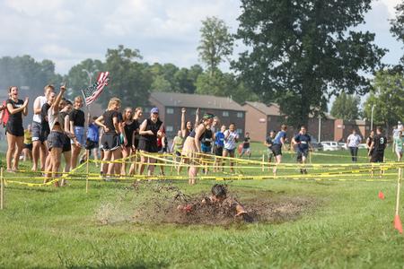 Students make their way through the mud pit during the Residence Life 1/2K. - Photo by Kristi McMurry Woody