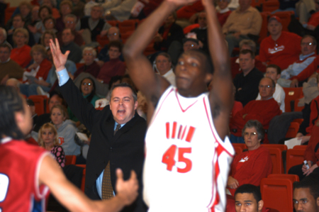Corey Burkett looks to pass inside during Union's win over Lyon College in the TranSouth Conference Tournament Championship game. Lyon Assitant Coach Monty McCurley communicates from the sidelines. - Photo by Jonathan Blair