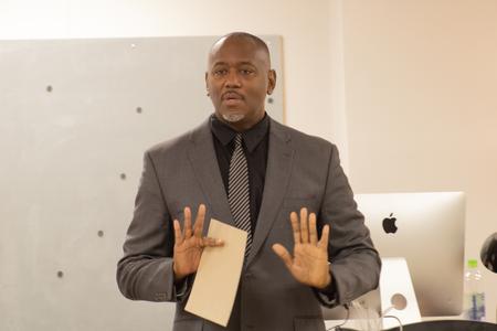 Artist Steve A. Prince speaks during a gallery lecture to open his exhibit in the Union Art Gallery. - Photo by Abigail Aspinwall