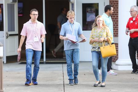 Prospective students and family members walk over to the academic fair during Day at the U. - Photo by Kristi McMurry Woody
