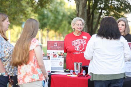 Sandra Brown, associate professor of nursing, talks with prospective students during Day at the U. - Photo by Kristi McMurry Woody