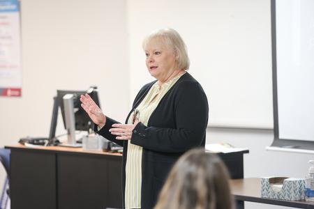 Melessia Mathis, assistant professor of education, gives a lecture in class. - Photo by Kristi McMurry Woody