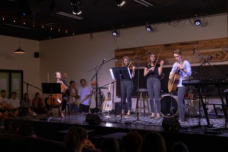 Students perform during Open Mic Night in Barefoots Joe. - Photo by Cade Smith