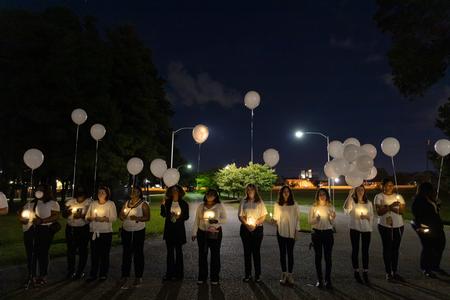 Social Work students help guide the participants in the Remember Me Walk for homicide survivors.  - Photo by Cade Smith