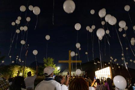 Participants in the Remember Me Walk for homicide survivors release balloons in memory of their loved ones. - Photo by Cade Smith