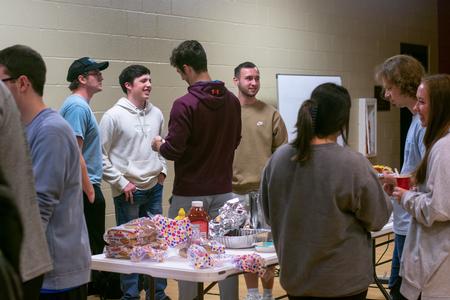 Students enjoy time with friends during the ATO chili cook-off.  - Photo by Faith Orr