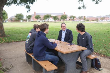 John Foubert, dean of the college of education, chats with students. - Photo by Kristi McMurry Woody