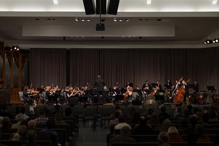 The Department of Music's band and orchestra perform in the chapel. - Photo by Cade Smith