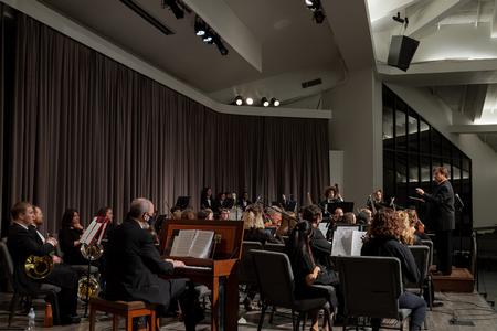 The Department of Music's band and orchestra perform in the chapel. - Photo by Cade Smith