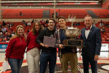 Lambda Chi Alpha accepts the Union Cup award during Homecoming 2021. - Photo by Cade Smith