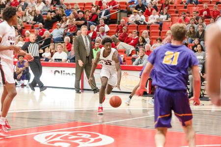 Ty Parks dribbles down the court during the Homecoming 2021 game against Bethel University. - Photo by Kristi McMurry Woody
