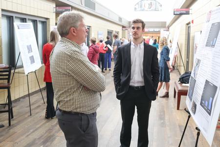 11/16/21 - Mark Bolyard, university professor of biology and department chair, asks Grant Jacobs, cell and molecular biology major, about his research during the Fall Poster Sessions. - Kristi McMurry Woody