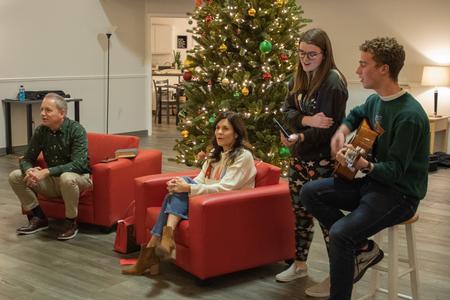 Dub and Susie Oliver, president and first lady of the university, host Christmas with the Olivers in the McAfee Commons. - Photo by Abigail Aspinwall