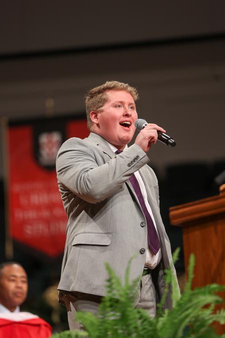 Kolby Atkins, music major, performs "You Can Dream" during Fall Commencement Services. - Photo by Kristi McMurry Woody