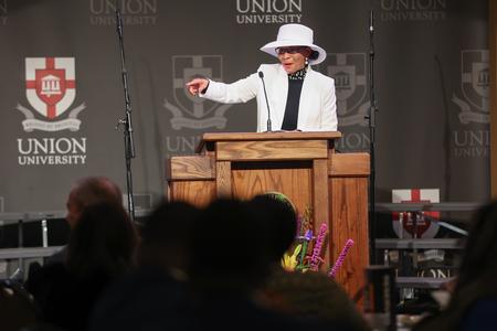 Mary McClure, wife of the late Wesley C. McClure, president emeritus of Lane College, accepts the Bastion of Freedom award in her husband's honor at the Black Heritage Month Celebration. - Photo by Kristi McMurry Woody