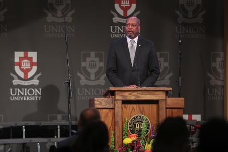Ernest Thomas Brooks II, attorney and city councilman, accepts the Bastion of Freedom award in his father's, the late Ernest Brooks Sr., honor at the Black Heritage Month Celebration. - Photo by Kristi McMurry Woody
