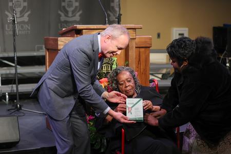 Shirlene Mercer (center) accepts her Bastion of Freedom award during the Black Heritage Month Celebration in the Grant Events Center. - Photo by Kristi McMurry Woody