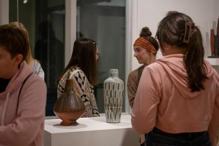 Students view the work of Randy Johnston & Jan McKeachie Johnston in the Union Art Gallery. - Photo by Faith Orr