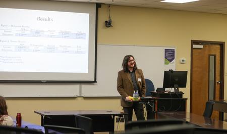 Benjamin Murray, senior sociology major, gives his senior presentation, "The Relationship between Socioeconomic Status and Health Care Disruptions due to COVID-19," for the Scholarship Symposium. - Photo by Suzanne Rhodes