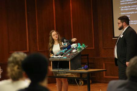 Sydni Caruvana and Caleb Steele share their senior engineering presentation, "Microgrids: An Interactive Model," during the Scholarship Symposium. - Photo by Suzanne Rhodes