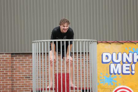 Dave Edgren leaving the dunk tank soaked at ResLife's Field Day event. - Photo by Eli Creasy