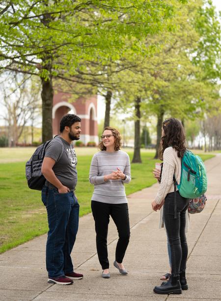 Jeremiah Chapman and Maria Wentley chat with Renee Litscher, assistant professor of nursing. - Photo by Kristi McMurry Woody