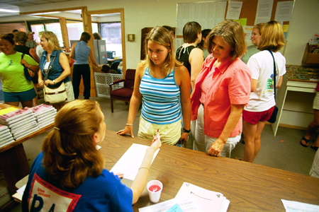 Freshmen see their first Union smiling face as they check in with the Resident Assistant during Freshman Move-In. - Photo by Justin Veneman