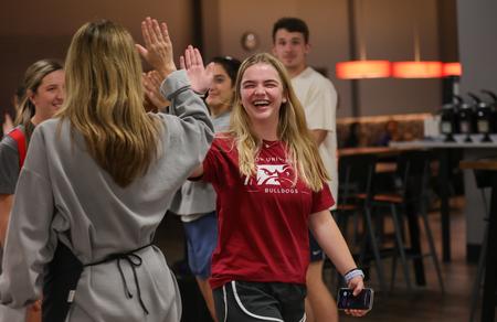 Gracie Shaddox is greeted by a Union staff member during the annual Food for Finals event. - Photo by Suzanne Rhodes