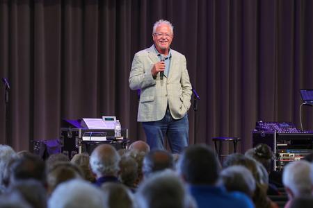 Dennis Swanberg performs stand-up comedy at the annual Senior Adult Extravaganza. - Photo by Suzanne Rhodes