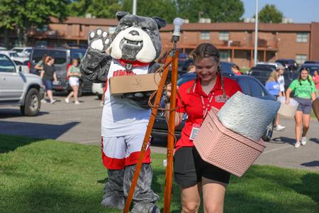 Buster and Union junior, Ashlea Armstrong, help move in Union's newest students during freshmen move-in day. - Photo by Suzanne Rhodes