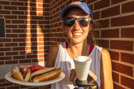 Student Rachel Vanpelt posing with her meal at ResLife's Block Party cookout for Labor Day. - Photo by Abigail Aspinwall