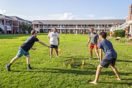 Students play spikeball on the Grace Quad during ResLife's Labor Day Block Party. - Photo by Abigail Aspinwall
