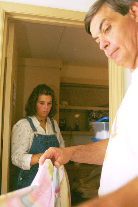 Freshman Brittany Stephans and her father begin to organize her dorm room during Freshman Move-In. - Photo by Amanda Smith
