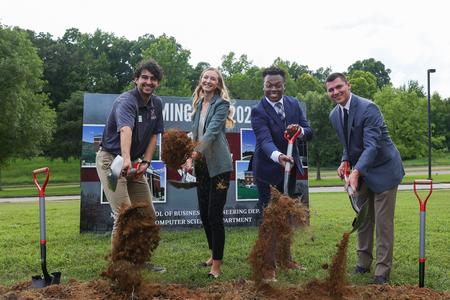 Students help break ground on a 40,000-square-foot academic building on the Great Lawn that will house the McAfee School of Business and the departments of computer science and engineering. - Photo by Suzanne Rhodes