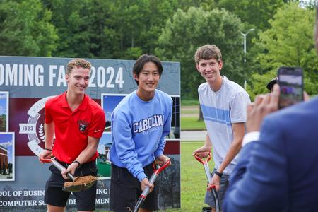 Students help break ground on a 40,000-square-foot academic building on the Great Lawn that will house the McAfee School of Business and the departments of computer science and engineering. - Photo by Suzanne Rhodes