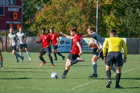 Union student athlete, De Vries, in mid-kick during Union men's soccer match against Spring Hill College.