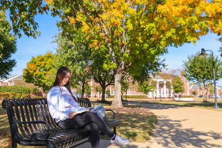 A Union student enjoys reading on a beautiful fall day outside of the Bowld Commons. - Photo by Eli Creasy