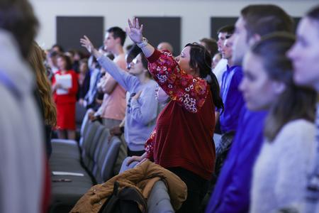 Students and staff worship beside each other at a Stand for Life chapel service. - Photo by Eli Creasy