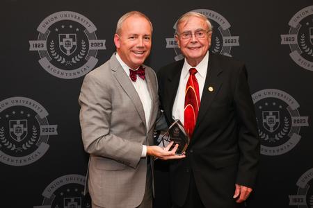 President Oliver presents the Alumnus of the Year Award to John Adams during the Meritorious Service Awards banquet. This award is presented to a Union graduate for distinction in his or her profession, service to mankind and/or contribution to Union University. Adams served as Union’s vice president for religious affairs and professor of practical Christian ministries at Union from 1982-1999. He has also served several churches as pastor and interim pastor. - Photo by Suzanne Rhodes