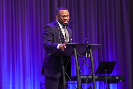 Jeremy Seward ('12), pastor of True Holiness Deliverance Temple, speaks in chapel. - Photo by Suzanne Rhodes