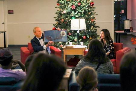 President Dub Oliver and first lady, Susie Oliver, read "A Visit from St. Nicholas" poem to students during the annual Christmas with the Olivers event. - Photo by Suzanne Rhodes