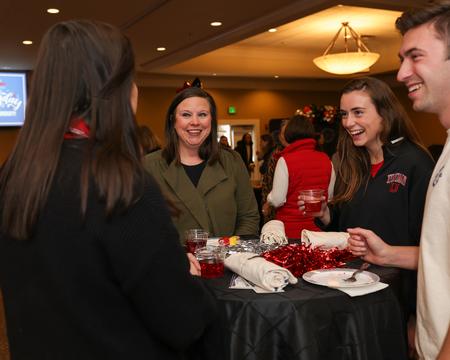 Staff members Julie Bradfield, Emma Cate Hare, Sallie Forester and Eli Creasy chat during Union's 200th birthday party. - Photo by Suzanne Rhodes