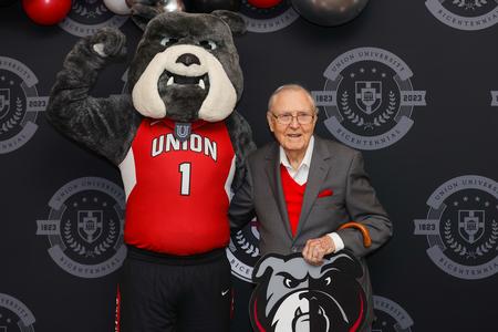 Hyran Barefoot, Union president from 1987-1996, poses with Buster the Bulldog during Union's 200th birthday party. - Photo by Suzanne Rhodes