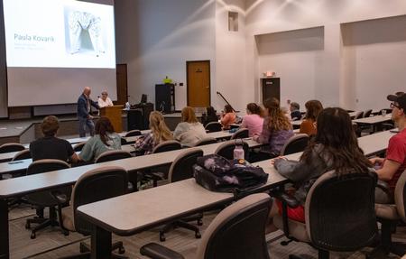 Paula Kovarik, full-time artist and fiber art workshop teacher from Memphis, Tenn., presented a lecture on her recent exhibit in the art gallery that featured her stitching art. - Photo by Lyla Dietz