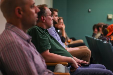 Randy Schwindt, professor of engineering, takes in presentations by engineering students during the 2023 UUSS. - Photo by Eli Creasy