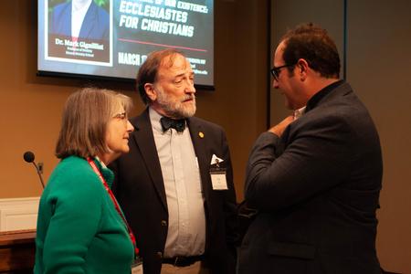 Hal and Mary Anne Poe fellowship with Mark Gignilliat, professor of divinity at the Beeson School of Divinity, prior to the Ryan Center's annual Bible Conference on the book of Ecclesiastes. Gignilliat was the keynote speaker for the Bible Conference. - Photo by Lauren Steed