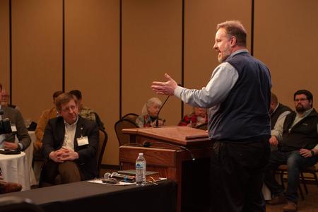 Mike Garrett, director for the Ryan Center for Biblical Studies, introduces Mark Gignilliat at the opening plenary session for the annual Spring Bible Conference. - Photo by Lauren Steed