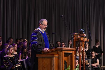 Provost John Netland introduces new faculty members during Fall Convocation. - Photo by Karley Hathcock